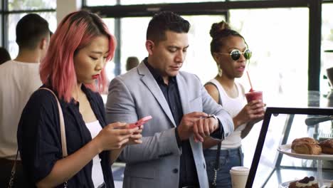 a busy cafe scene capturing urban life: people interacting while ordering food and drinks, highlighting diverse social dynamics and daily routines