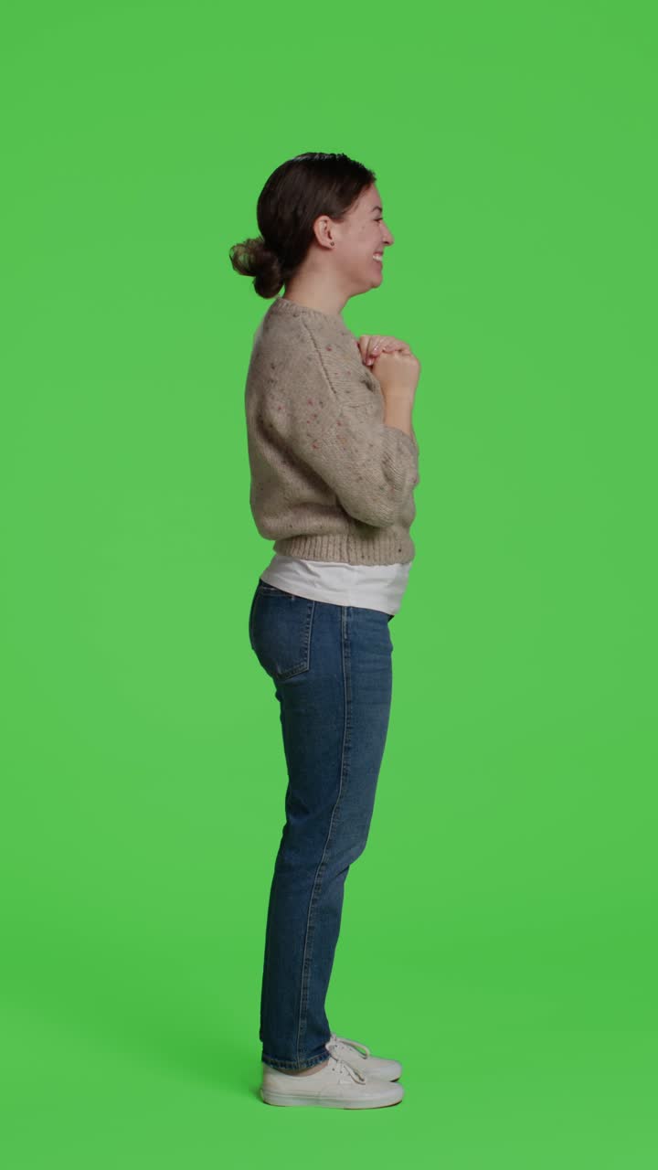 Vertical video: Profile of caucasian woman greeting someone with wave