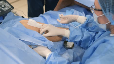 medical procedure on a patient's leg