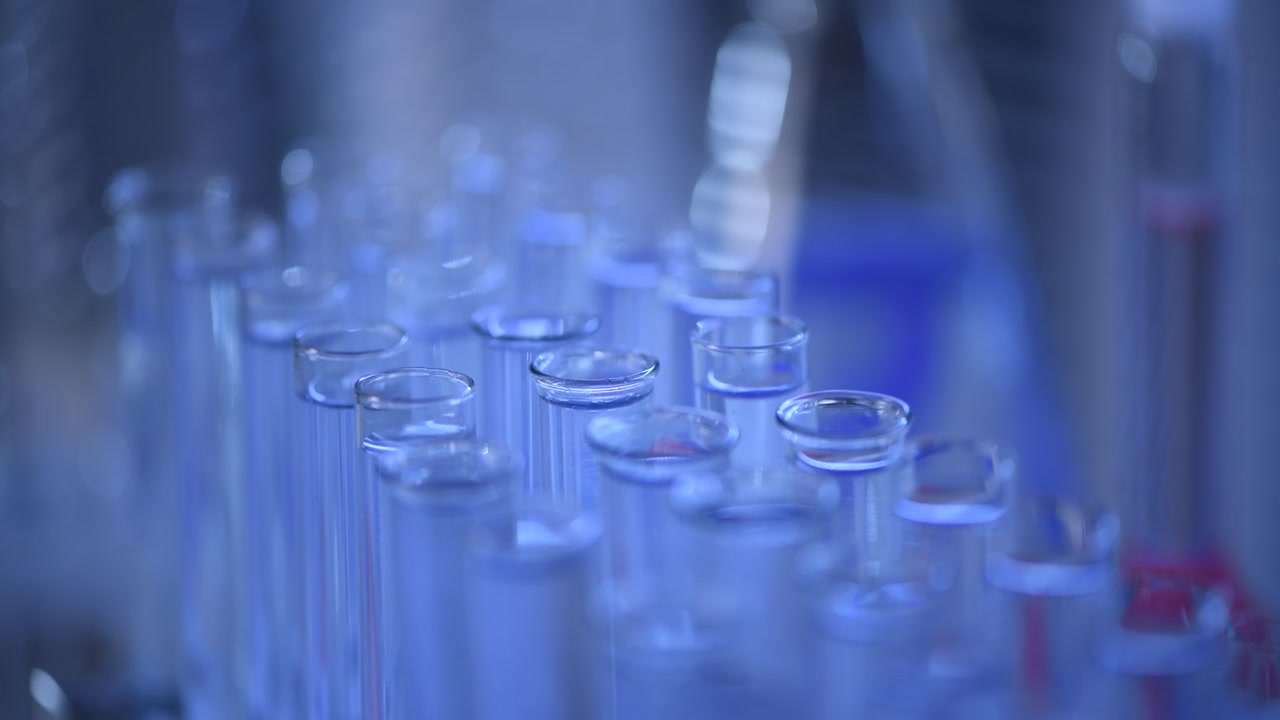 Close-up of Glass Test Tubes with Clear Liquid in a Laboratory