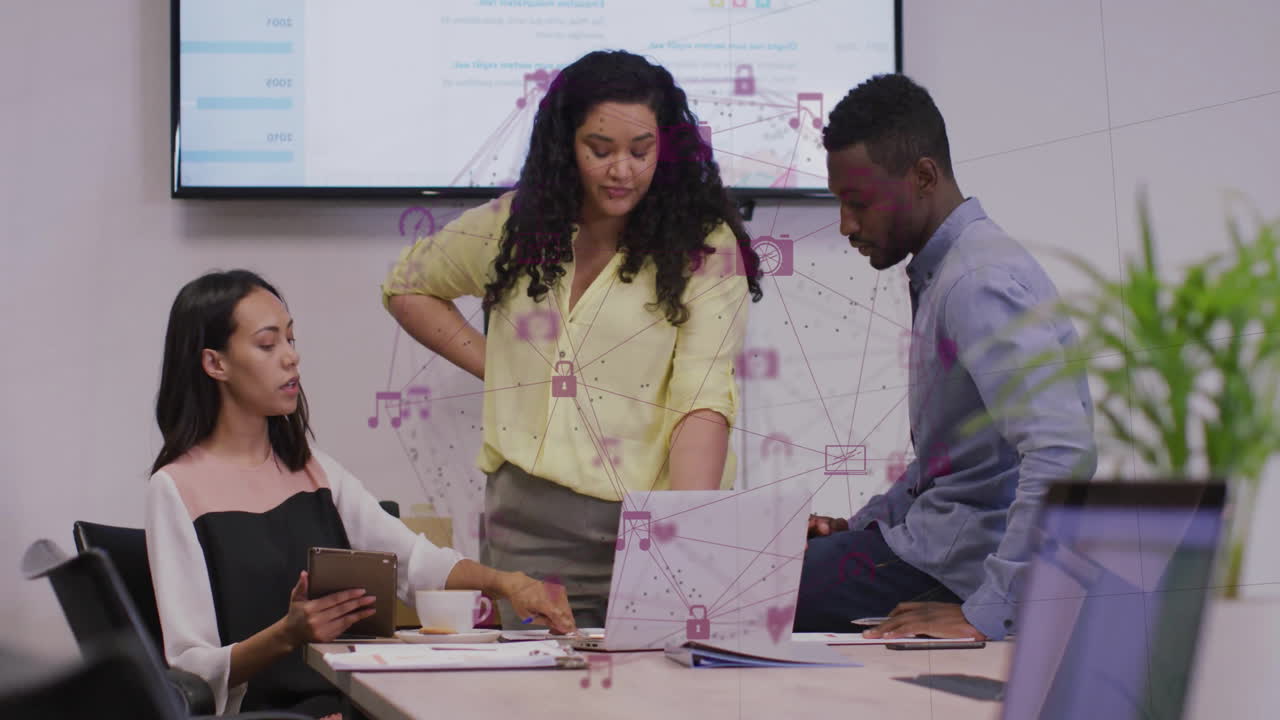 Animation of network of connections with icons over diverse business people discussing work