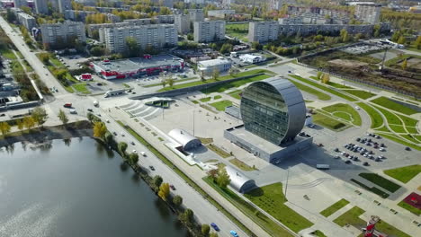 aerial view of a city with modern architecture and park