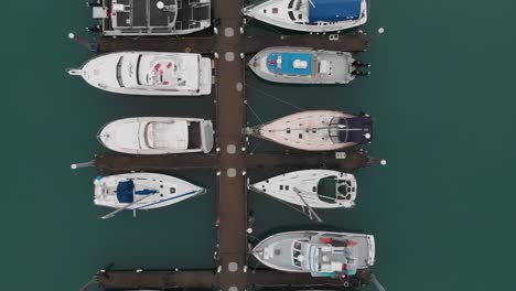 top down aerial view of bounded boats in harbor