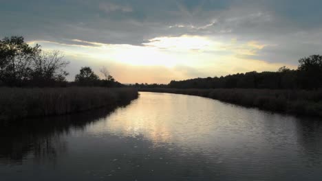 low drone shot close to the river fly upstream in light rain-1
