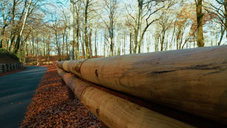 detail of wooden road barriers at the edge of a road