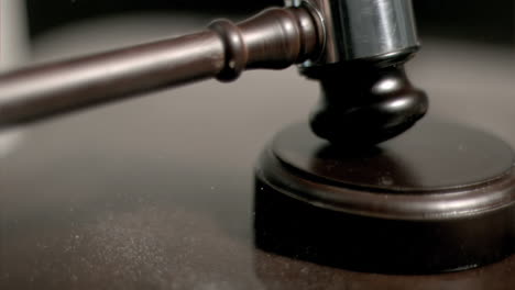 Hand-pounding-gavel-in-super-slow-motion