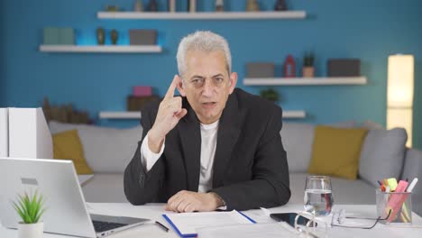 Home-office-worker-man-looking-nervously-at-camera.