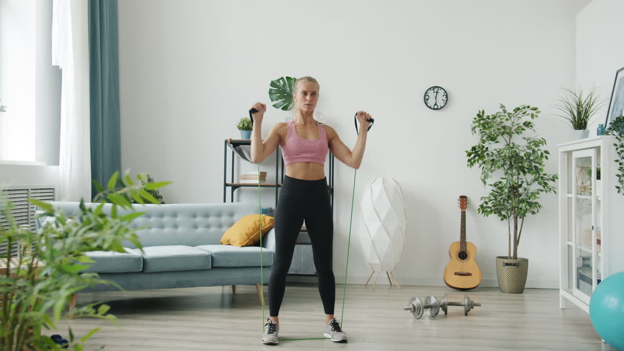 Woman Doing Resistance Band Arm Workout at Home