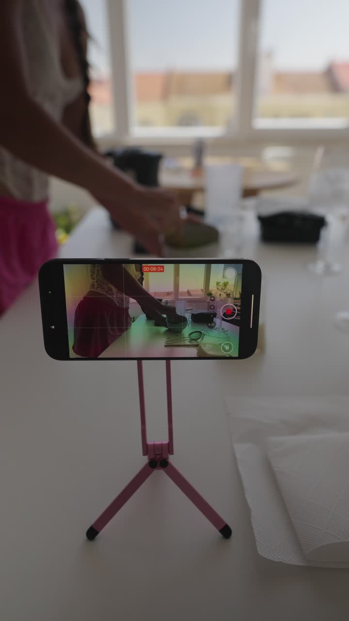 Filming a cooking video with a smartphone on a tripod