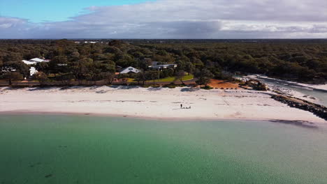 Aerial-view-of-drone-flying-above-beautiful-beach-with-views-of-ocean-waves