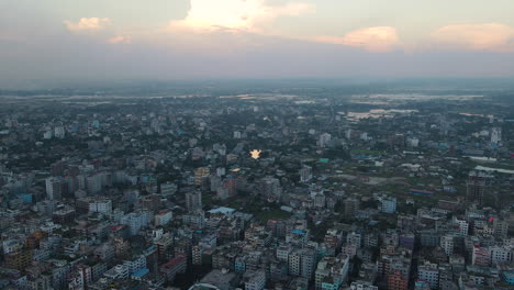 aerial: city view of urbanization with dense buildings - top zoom out shot