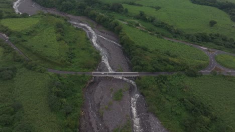 orbit shot of bridge over the achiguate river at guatemala during daytime, aerial