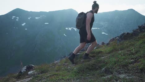 portrait of a person hike at lonketind mountains in senja island, norway