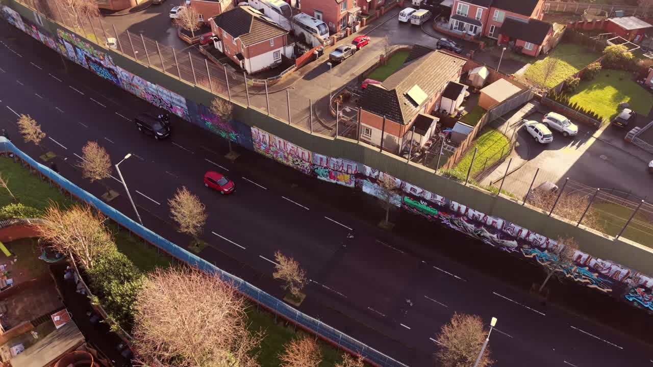 4K 60FPS aerial video reveal of the Belfast Peace Wall Interface in Belfast, Northern Ireland. The murals explore the politics of NI and worldwide. Produced with Rec709 color