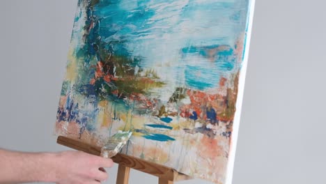 slow motion 240 fps close up of the hands of a professional artist who paints abstract paintings - slow motion 240 fps, close up of the hands of a professional artist who paints abstract paintings. drawing a picture with oil paints