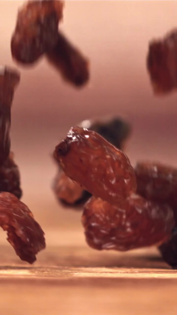 Delicious Dried Raisins Falling in Slow Motion
