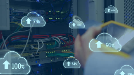 Animation of clouds with increasing numbers over hands of caucasian man working with servers