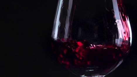 pouring wine in wine glass at high frame rate