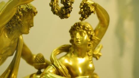 detailed bronze sculpture of mythological figures on an antique clock