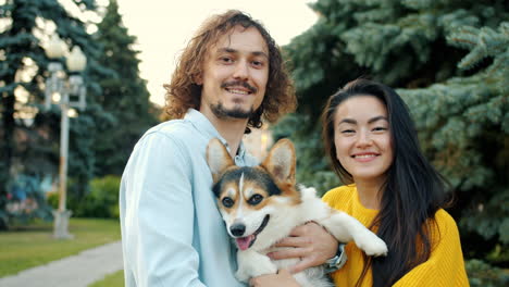 couple with a dog in a park