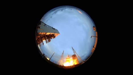 an extreme fisheye wide angle view of the nasa orion rocket liftoff from launchpad 2