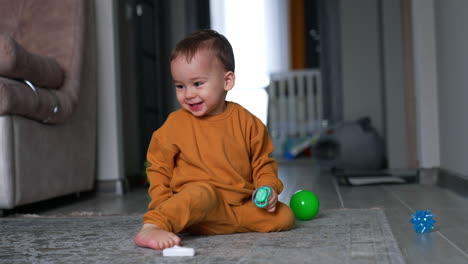 happy toddler playing with toys