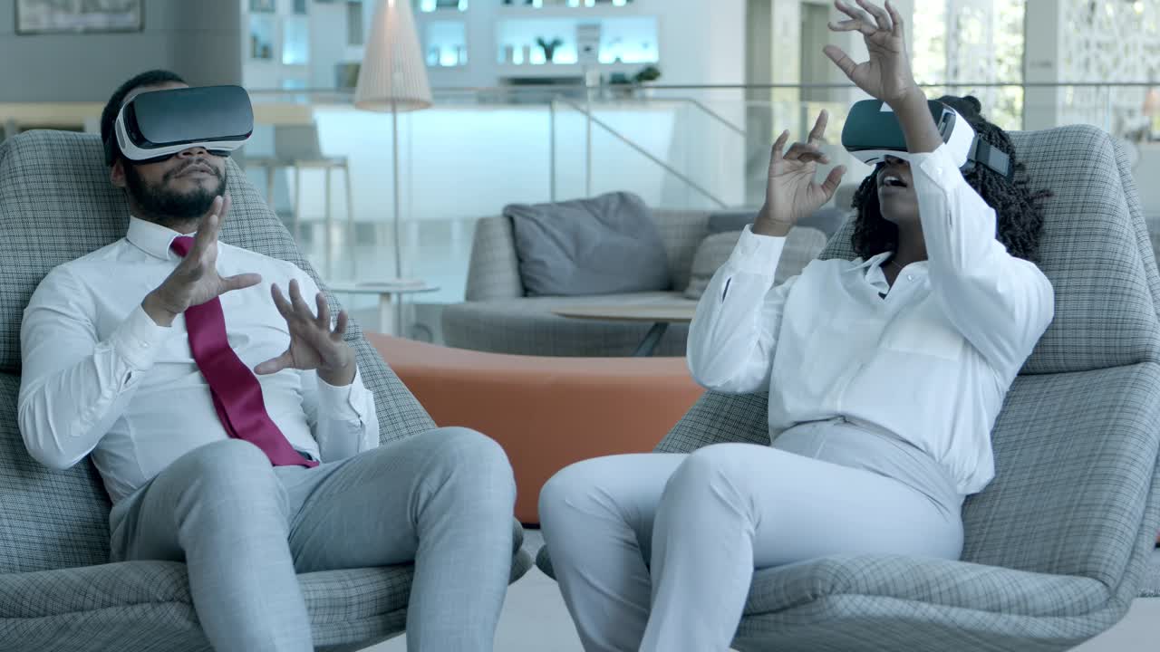 Cheerful colleagues in vr headsets