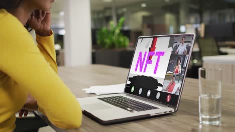 video of african american woman having nft video call on laptop with diverse coworkers