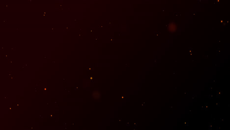 partículas rojas brillantes de luz explotando sobre un fondo negro