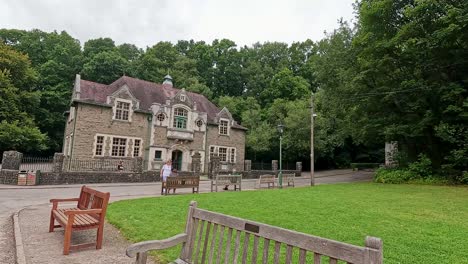 visitor walks through scenic museum landscape