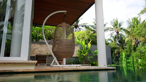 egg swing hammock by the pool at the luxury villas in ubud, bali indonesia