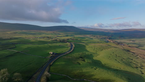 High-Establishing-Shot-over-Yorkshire-Dales-Landscape-and-Farmland-Barn