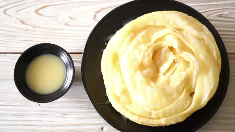 fried crispy roti dough with sweetened condensed milk