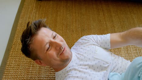 father playing with his baby boy in living room 4k