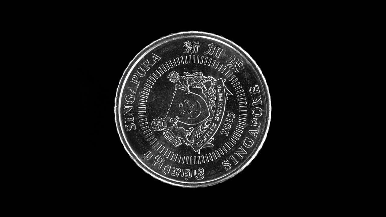 Singapore 50 cent 2015 obverse with national coat of arms and multilingual text, macro loop on black background