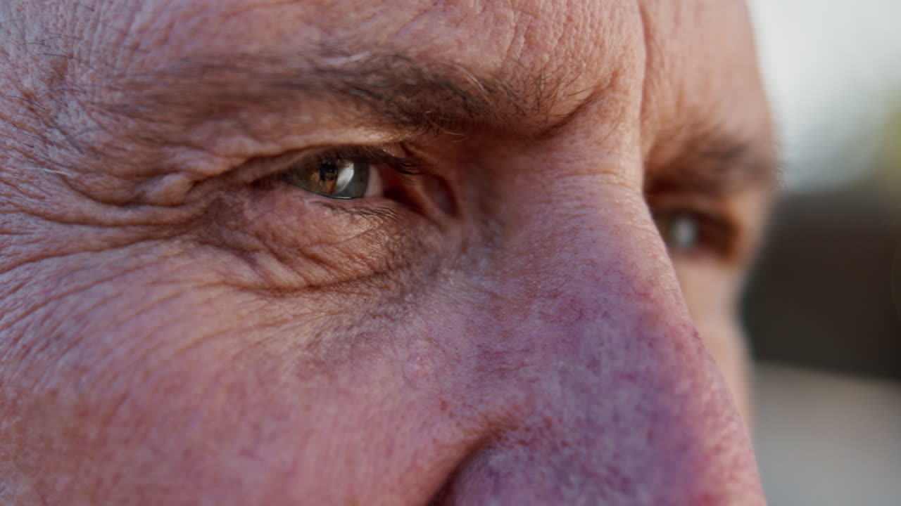 Close-up of a man's face showing wrinkles and aging