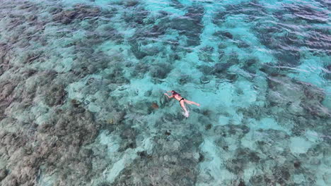 Female-Tourist-Snorkeling-In-Beautiful-Lagoon-In-Bali,-Indonesia