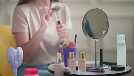 woman applying makeup