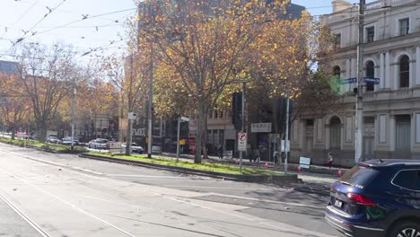 pedestrians and vehicles at a city intersection