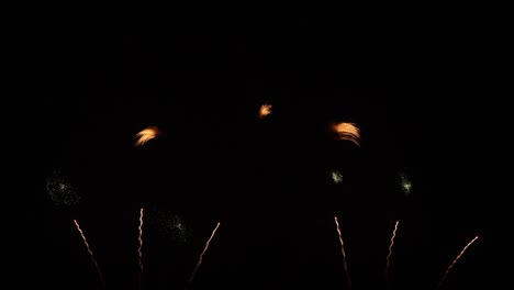 real fireworks on deep black background sky, beautiful colorful fireworks shiny display at night, real time 4k footage.