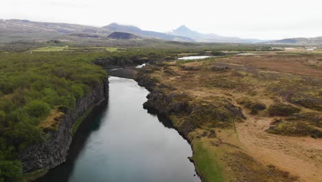 Showing-aerial-footage-over-a-river-coming-from-Glanni-waterfall-in-Iceland