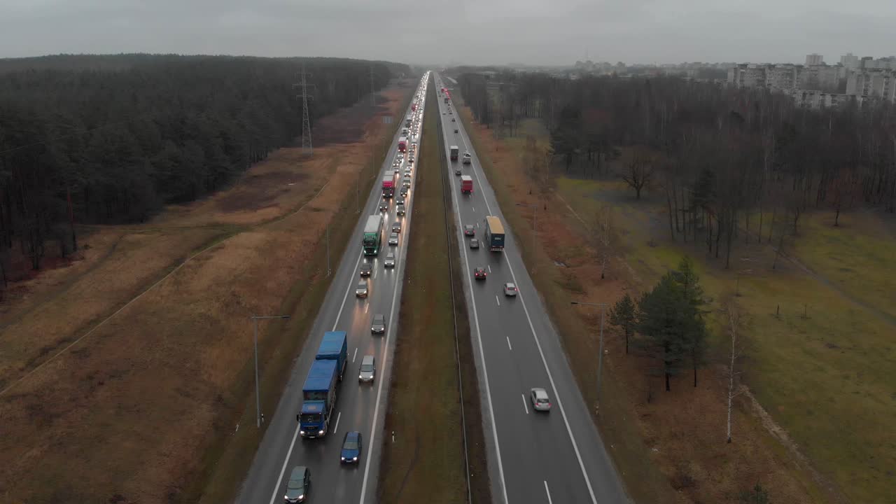 Tilt down view of rush hour highway from the city traffic jam people travelling to work in the morning