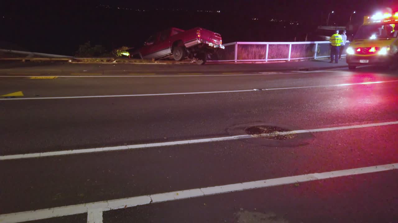 Emergency respondents on scene, ambulance and fire engine lights flashing.