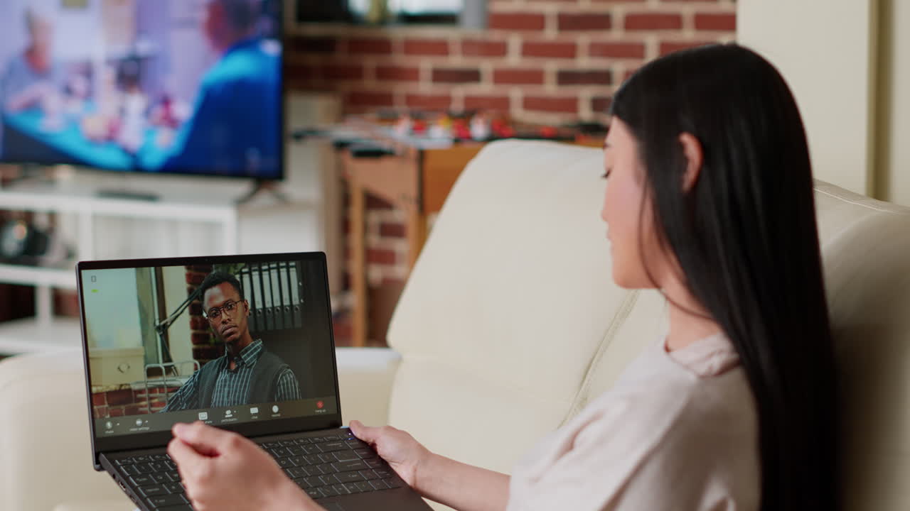 Woman on video call with man using laptop