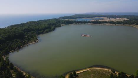 High-pan-at-300ft-over-Dune-Harbor-Lake-near-Lake-Michigan's-Coast