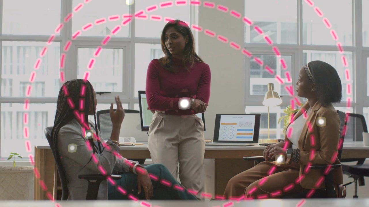 Female business team reviewing data spot appearing pink dashed circles expanding over group