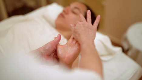 freeing knots of hand while massaging during therapy spa