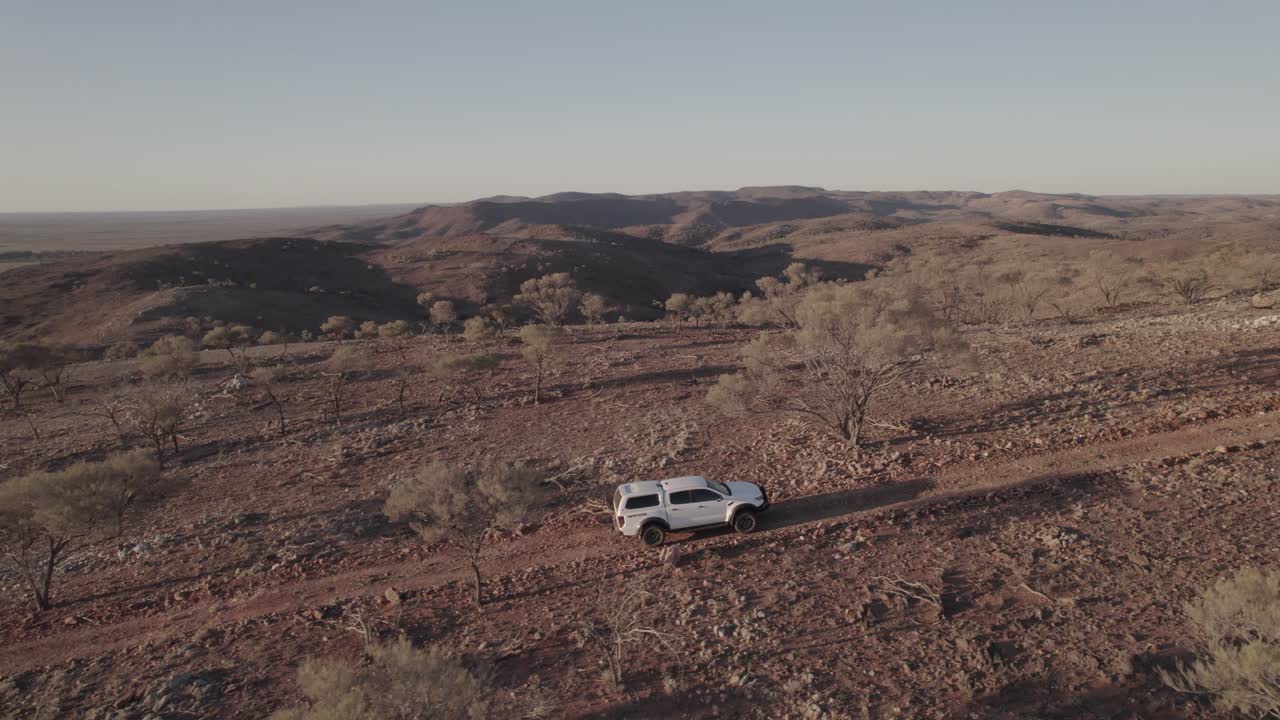 Exploring the rugged hills in the Outback Australia in a four-wheel-drive