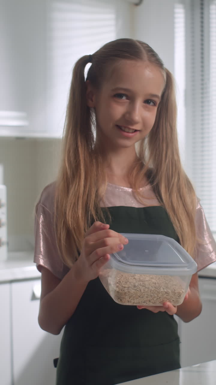 Portrait of Positive Teen Girl Cooking at Kitchen