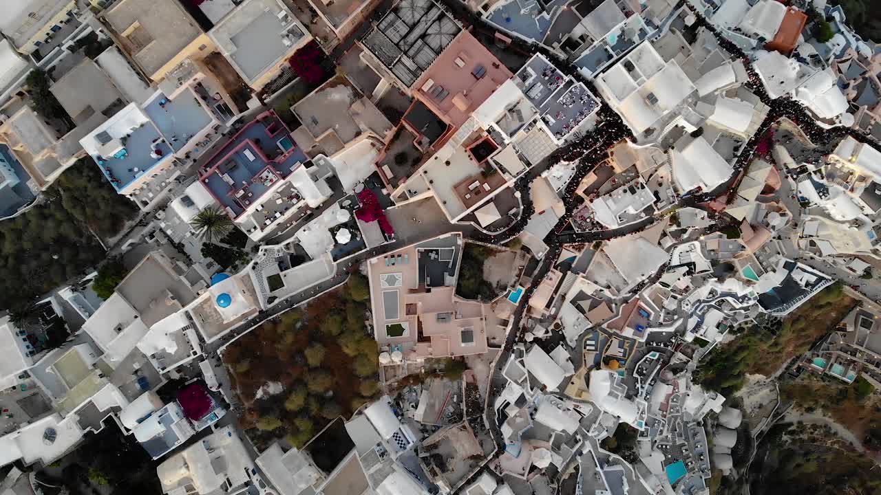 Drone shoot zoom out top view of Santorini village